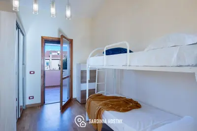 Letto o letti in una camera di Casa Aglaia