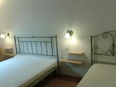 Letto o letti in una camera di Villetta Stella Marina