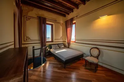 Letto o letti in una camera di Superattico Villanova