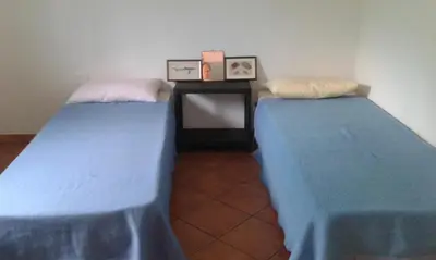 Letto o letti in una camera di Su Furriadroxu Tuerredda
