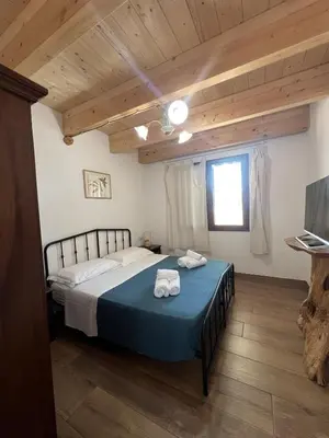 Letto o letti in una camera di Casa vacanza Il Guardiano Delle Due Baie