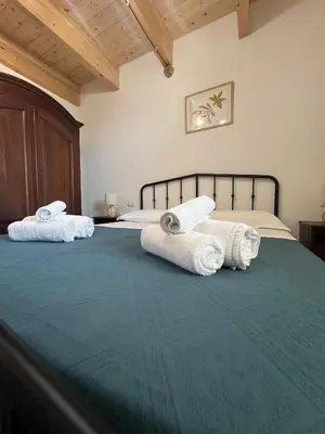 Letto o letti in una camera di Casa vacanza Il Guardiano Delle Due Baie