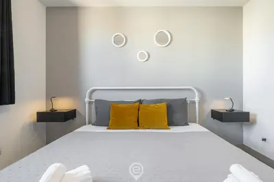 Letto o letti in una camera di Via Giardini House