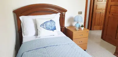 Letto o letti in una camera di Villa Zellino