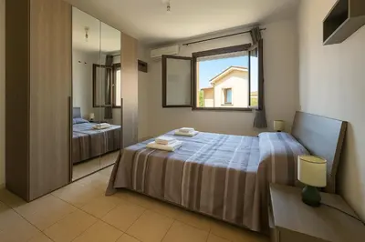 Letto o letti in una camera di Casa Amelia Oristano, 10 minutes from the beaches