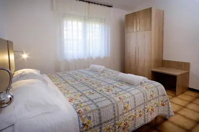 Letto o letti in una camera di Residence Appartamenti Caffarena