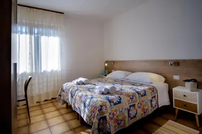 Letto o letti in una camera di Residence Appartamenti Caffarena