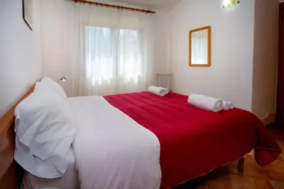 Letto o letti in una camera di Residence Appartamenti Caffarena