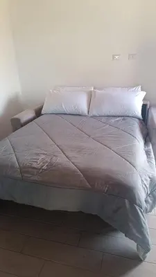 Letto o letti in una camera di I giardini di Mina
