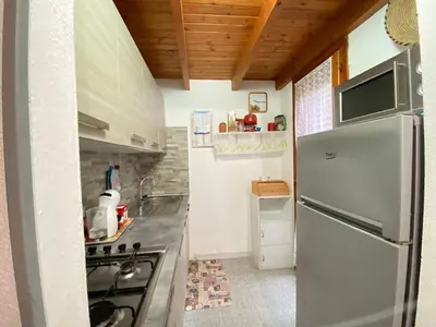 Cucina o angolo cottura di Costa Rei Panoramic Terrace- Free Parking- BBQ-Netflix