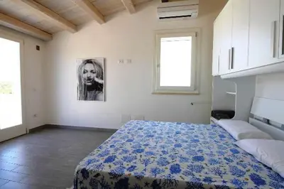 Letto o letti in una camera di Villa con piscina