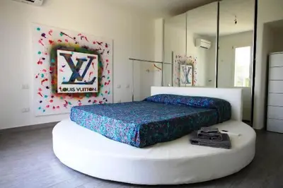 Letto o letti in una camera di Villa con piscina
