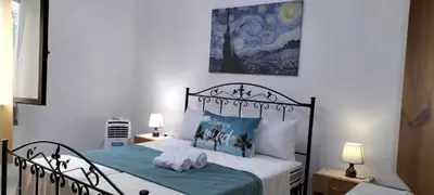 Letto o letti in una camera di Casa Vacanze al muro di cinta Carloforte