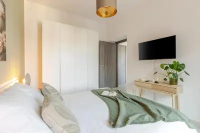 Letto o letti in una camera di Attico180 - Attico in centro con Terrazza - Wifi e Netflix