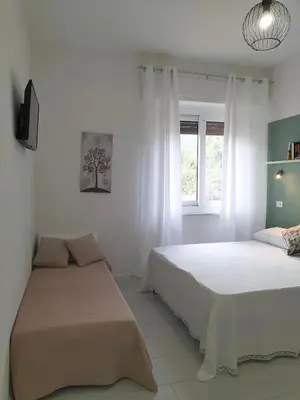 Letto o letti in una camera di Lugore Room