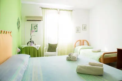 Letto o letti in una camera di B&b Margherita