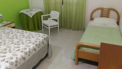 Letto o letti in una camera di B&b Margherita