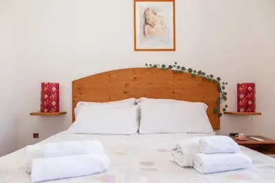 Letto o letti in una camera di Casa Isolotto D'Ogliastra - vista mare