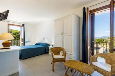Letto o letti in una camera di Hotel Agugliastra
