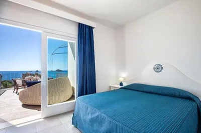 Letto o letti in una camera di Hotel Agugliastra