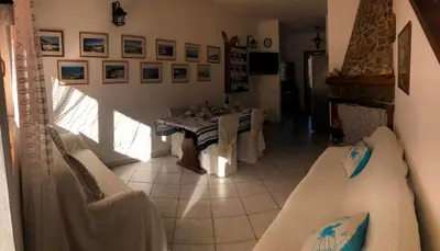 Area soggiorno di Andrea Frau - Casa Mandorleto new - Sardinia Villasimius-Peaceful Panoramic Terrace-full comfort air conditioning-WiFi-Parking-Privacy