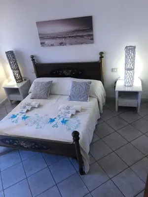 Letto o letti in una camera di Andrea Frau - Casa Mandorleto new - Sardinia Villasimius-Peaceful Panoramic Terrace-full comfort air conditioning-WiFi-Parking-Privacy