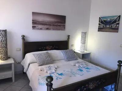 Letto o letti in una camera di Andrea Frau - Casa Mandorleto new - Sardinia Villasimius-Peaceful Panoramic Terrace-full comfort air conditioning-WiFi-Parking-Privacy