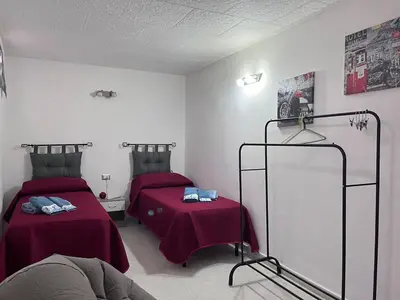 Letto o letti in una camera di Casa Singola Accogliente