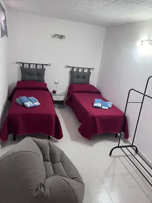 Letto o letti in una camera di Casa Singola Accogliente