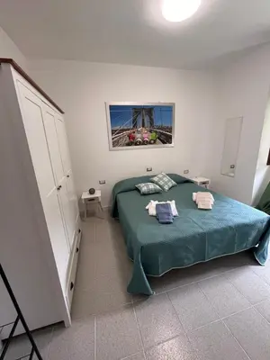 Letto o letti in una camera di Casa Singola Accogliente