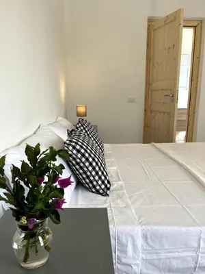Letto o letti in una camera di Villa 6 Ospiti con Giardino vicino al Mare - Flumini, Quartu Sant'Elena, Cagliari