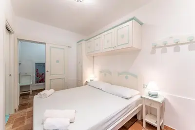 Letto o letti in una camera di SandyMar House, Chia Sea View SouthSardiniaHolidays