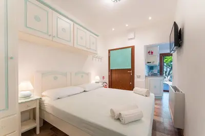 Letto o letti in una camera di SandyMar House, Chia Sea View SouthSardiniaHolidays