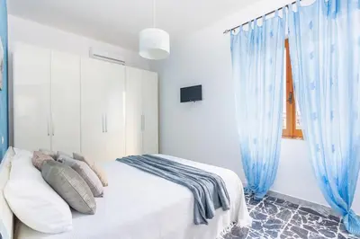 Letto o letti in una camera di Casa Oro -Pula Terrace and Wifi near downtown