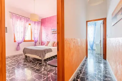 Letto o letti in una camera di Casa Oro -Pula Terrace and Wifi near downtown