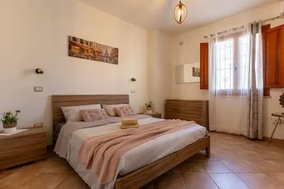 Letto o letti in una camera di Casa Lia