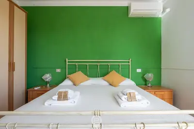 Letto o letti in una camera di Casa Daniela