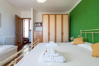Letto o letti in una camera di Casa Daniela