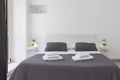 Letto o letti in una camera di Rainbow Marina Apartment