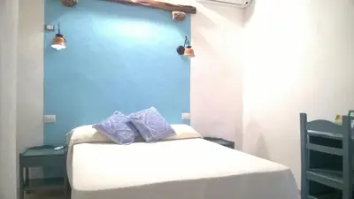 Letto o letti in una camera di hotel Piccolo Ranch