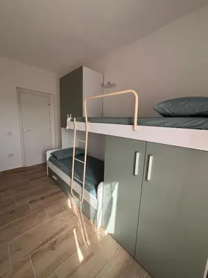 Letto o letti a castello in una camera di Casa Ottema 3
