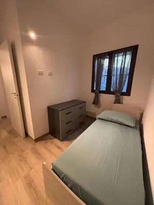 Letto o letti in una camera di Casa Ottema 2
