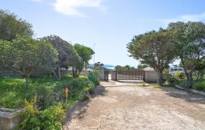 Giardino di Cozy Home In Torre Dei Corsari