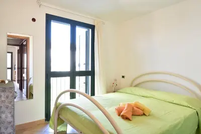 Letto o letti in una camera di Il mio angolo di Sardegna- 800mt dal mare