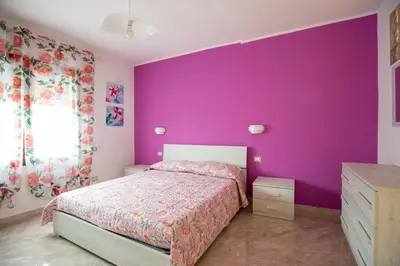 Letto o letti in una camera di Casa Vacanze Il Mirto Locale