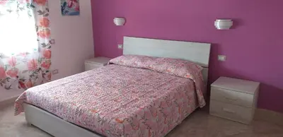 Letto o letti in una camera di Casa Vacanze Il Mirto Locale