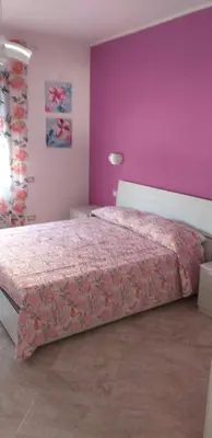 Letto o letti in una camera di Casa Vacanze Il Mirto Locale