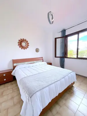 Letto o letti in una camera di Domu e Mari Sud Sardegna