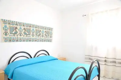 Letto o letti in una camera di Dommu Fruttu - Appartamento mare