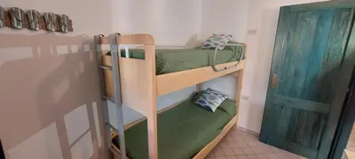 Letto o letti in una camera di Villa Tonino